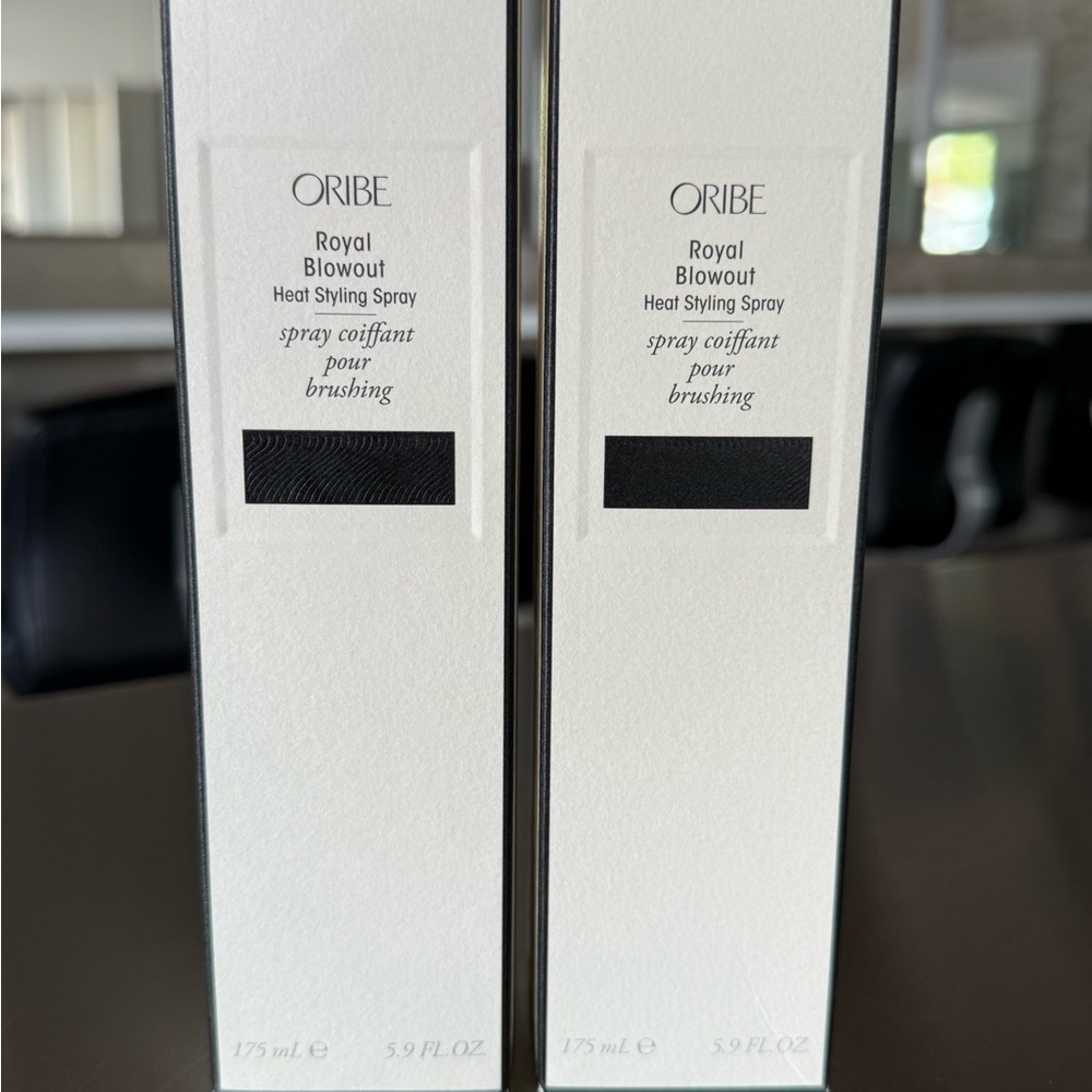 Oribe Royal Blowout Heat Styling Spray in Black and White